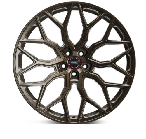 A bronze alloy wheel with an intricate geometric spoke design. The brand "Vossen" is embossed around the center cap, surrounded by a clean white background.