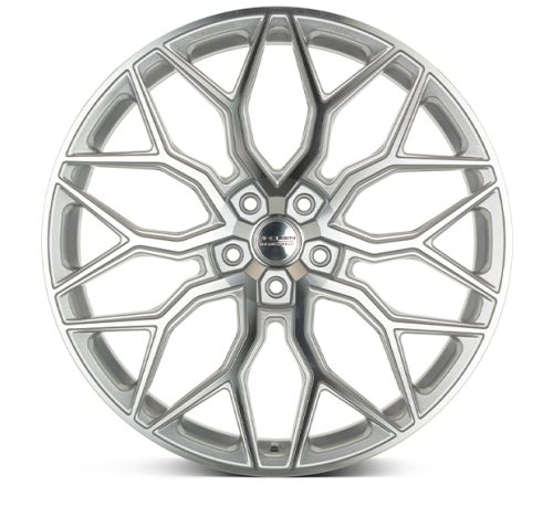 A silver alloy wheel with intricate, geometric spokes arranged symmetrically, set against a white background. Center cap text reads, "HRE / ADVANCED FORGED."