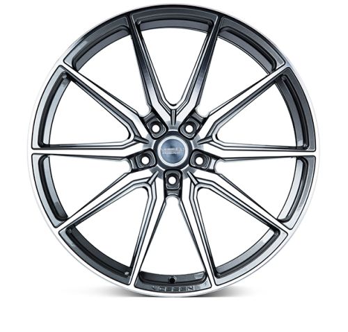 A multi-spoke alloy car wheel rim, displayed front-on, features a sleek, polished metal design. In the center, "VÖSSEN Forged" is inscribed, surrounded by a white background.