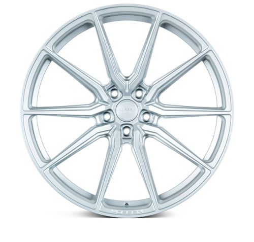 A silver alloy wheel with multiple thin spokes radiates symmetrically from the center. Text on the hub reads "OE Tuning Wheels," set against a plain white background.