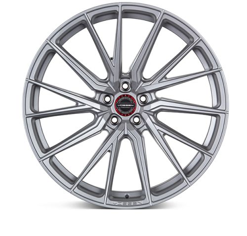 A silver alloy wheel with a multi-spoke design features a red circular center cap with "VOSSEN FORGED" text, set against a white background.