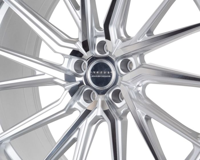 A metallic wheel rim with intricate, polished spokes radiates from the center, which reads "WHEELS BMXFORGED," set against a white background.