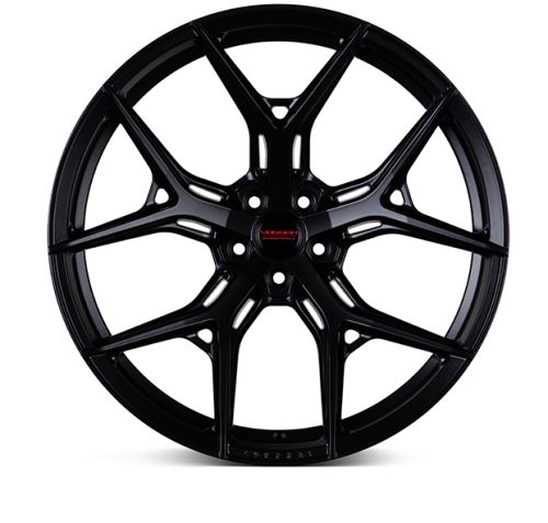 A black, multi-spoke car wheel rim is displayed against a white background. The center cap features the red text: "VOSSEN FORGED."