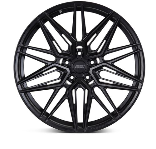 A black alloy wheel features intricate spoke patterns, displayed against a white background. The center cap reads "VOSSEN FORGED", conveying branding and framing the wheel's sophisticated design.