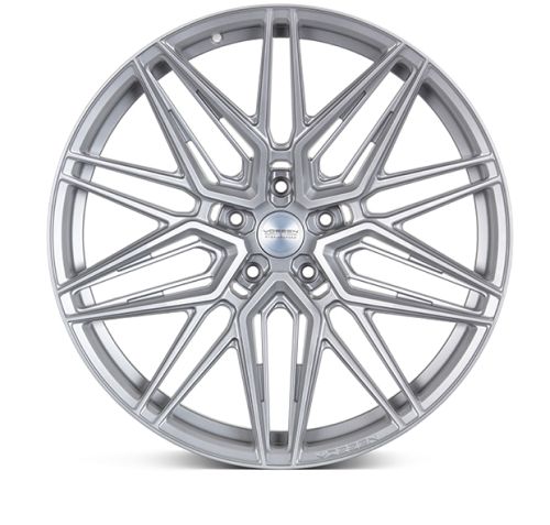 A silver alloy wheel with a complex, multi-spoke design set against a white background. Central hub text reads: "VOSSEN FORGED ENGINEERED ARTISAN SERIES."