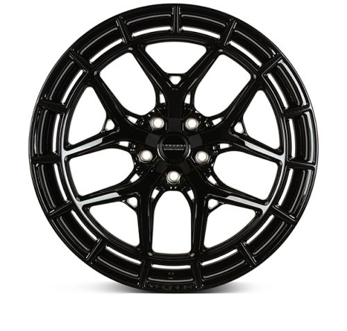 A black alloy wheel with a multi-spoke design sits against a white background. The center cap features the text: "VOSSEN FORGED."