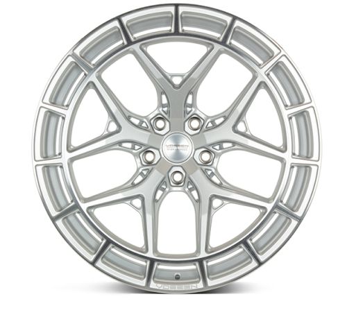 A silver alloy wheel with intricate spoke design and shiny surface, featuring the text "VOSSEN FORGED" on the center and "VOSSEN" at the bottom, set against a white background.