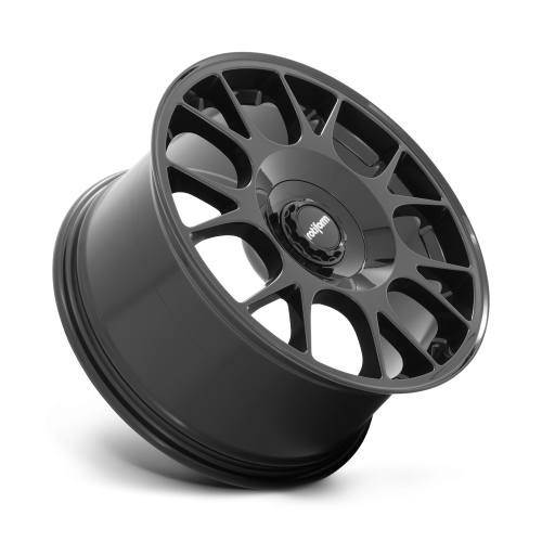 A glossy black alloy wheel with multi-spoke design rests against a white background. The central hub features the text “rotiform.”