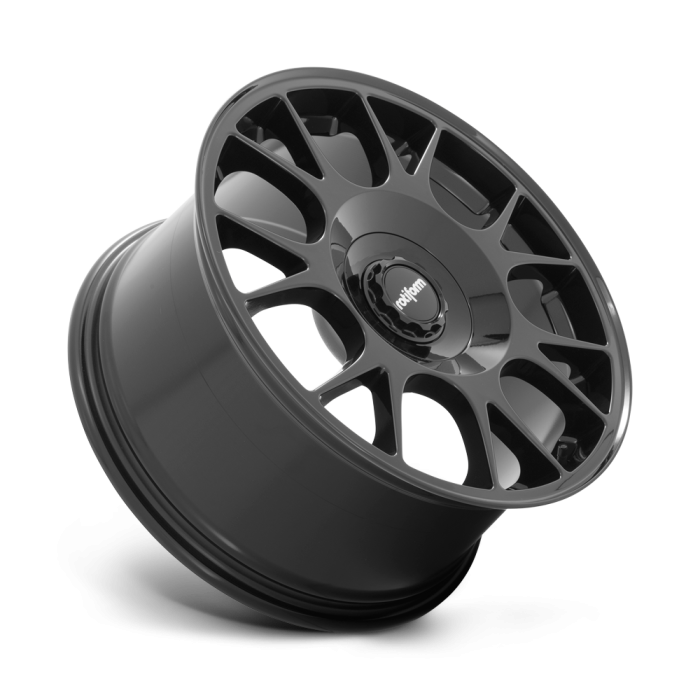 A glossy black alloy wheel with multi-spoke design rests against a white background. The central hub features the text “rotiform.”