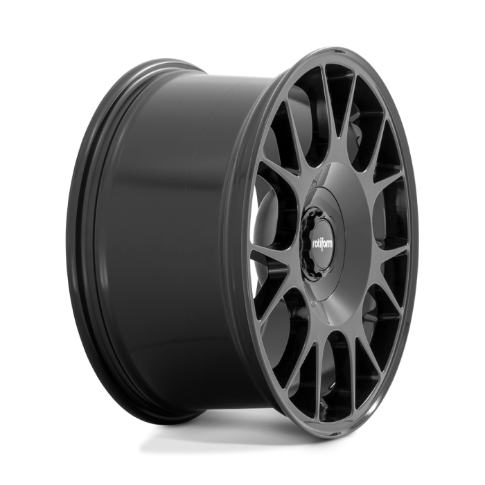 A black alloy wheel with a multi-spoke design is displayed against a neutral background. The center cap features the text "rotiform."