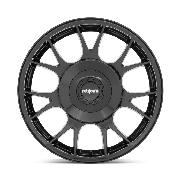 A black alloy wheel with intricate spokes features the logo "rotiform" in the center. The wheel is shown on a plain, neutral background.